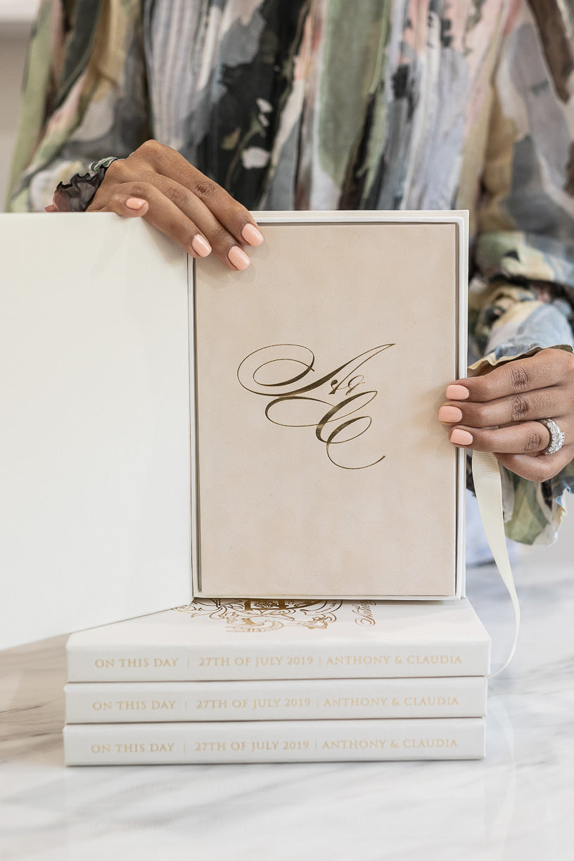 Wedding initials monogram in gold foil on suede invitation