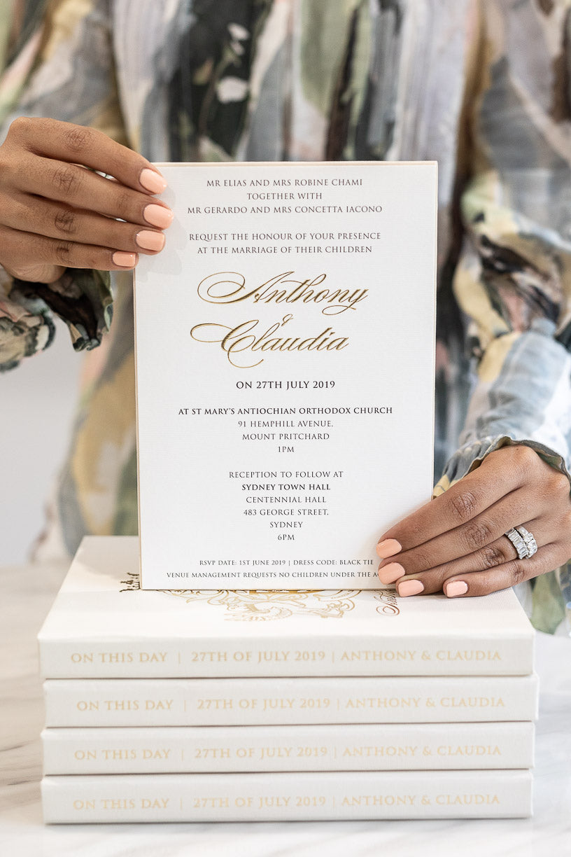 Elegant wedding invitation in luxury box embossed with gold foil