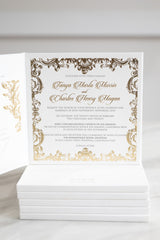 Luxury regal wedding invitation in gold with ornate border