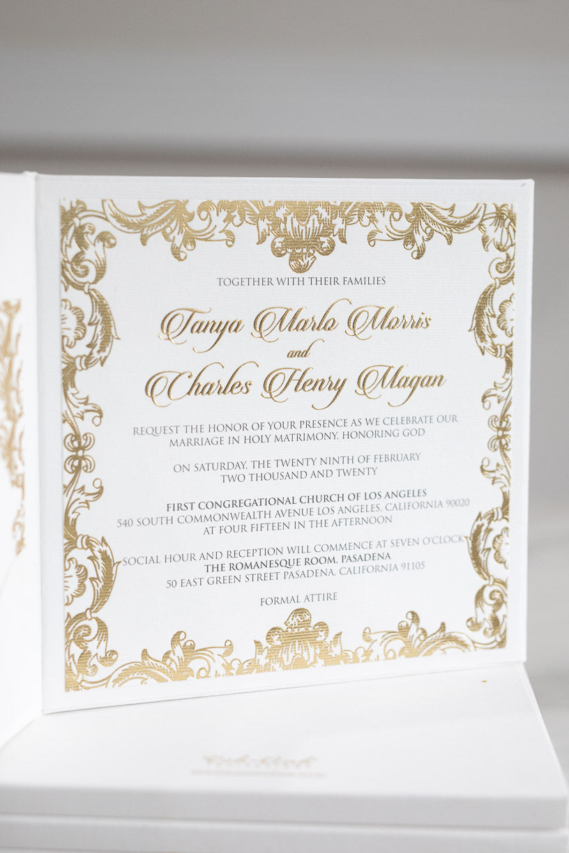 Luxury regal wedding invitation in gold with ornate border