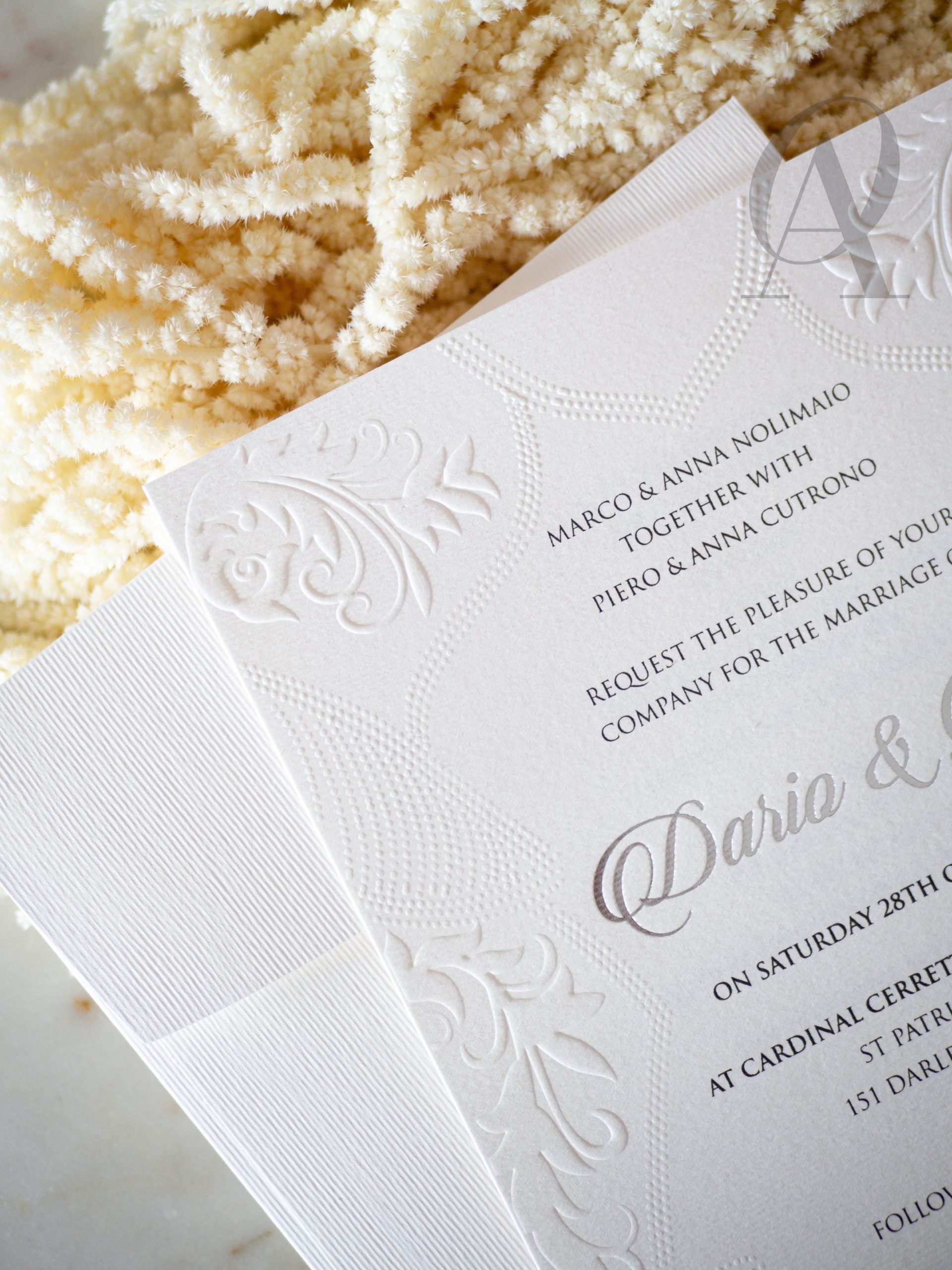 Embossed invitations with silver foil