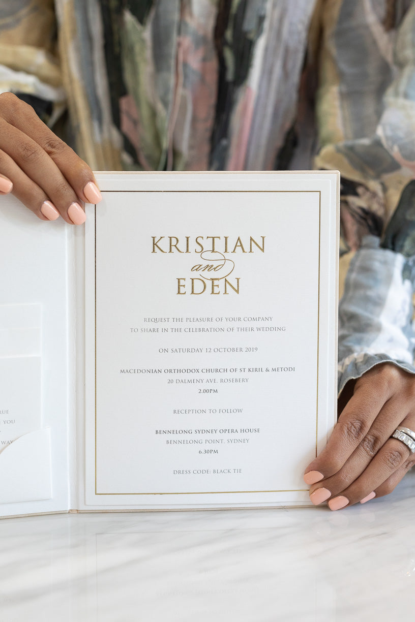 Gold and ivory wedding invitation book with a pocket fold