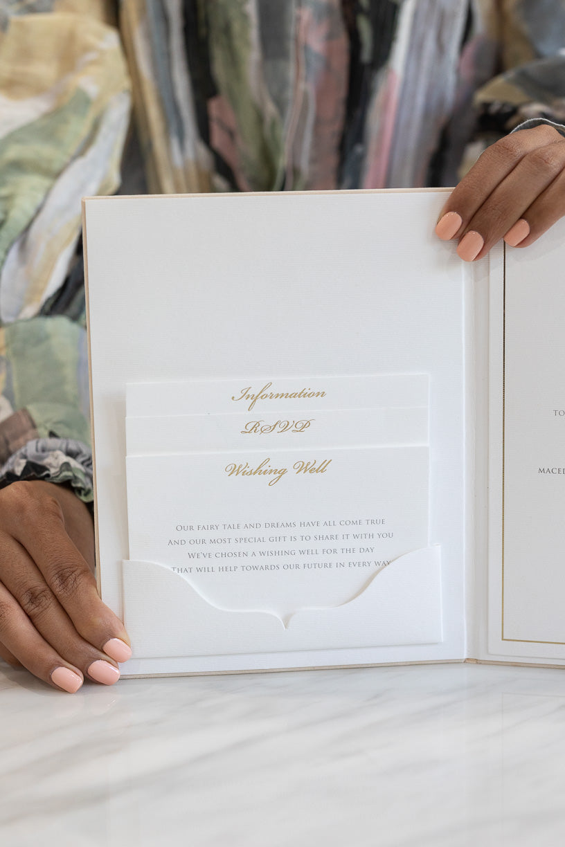 Gold and ivory wedding invitation book with a pocket fold