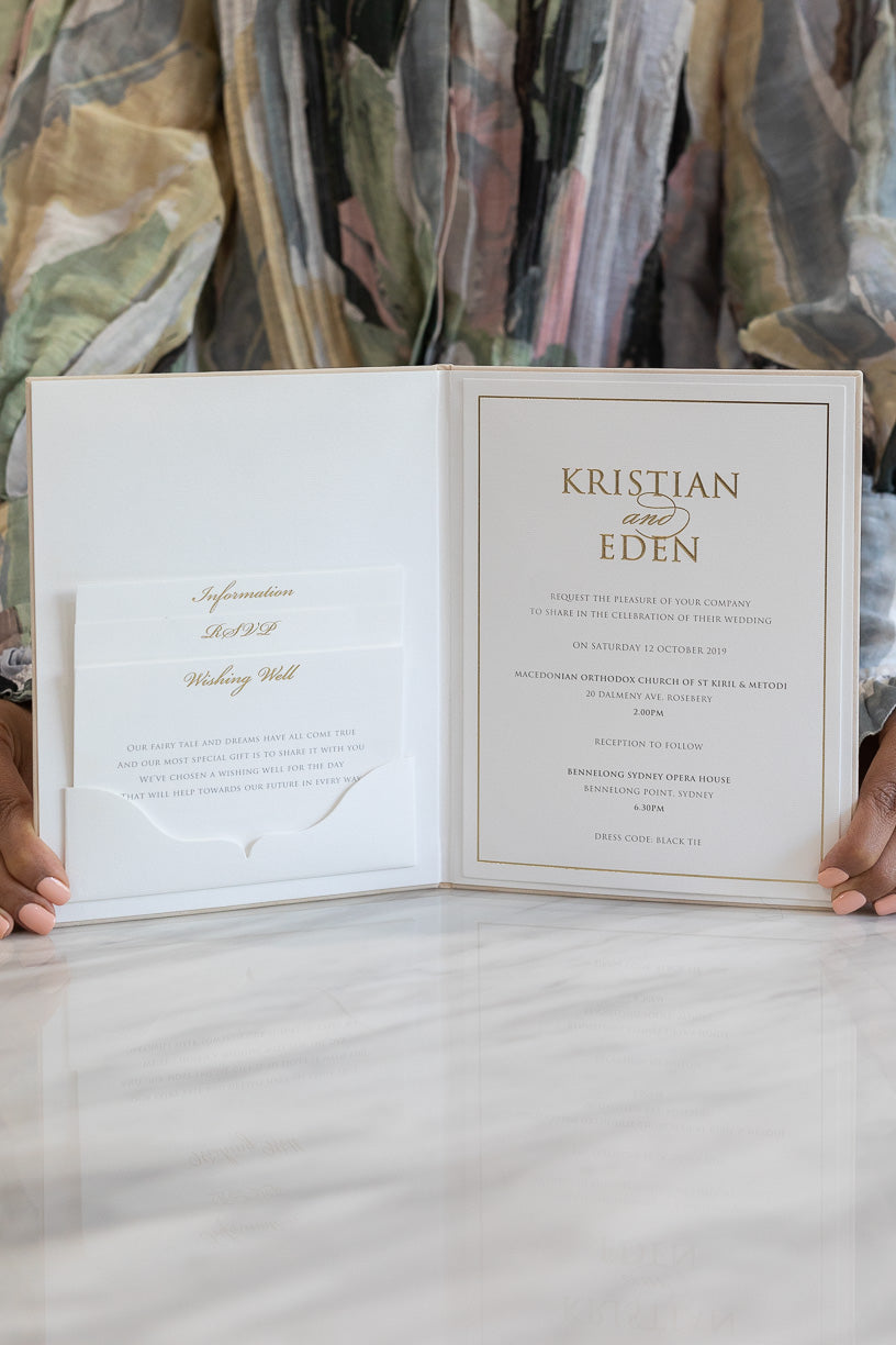 Gold and ivory wedding invitation book with a pocket fold