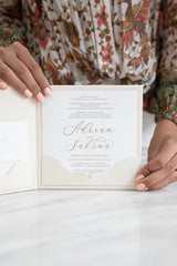 Embossed floral wedding invitation with modern calligraphy script