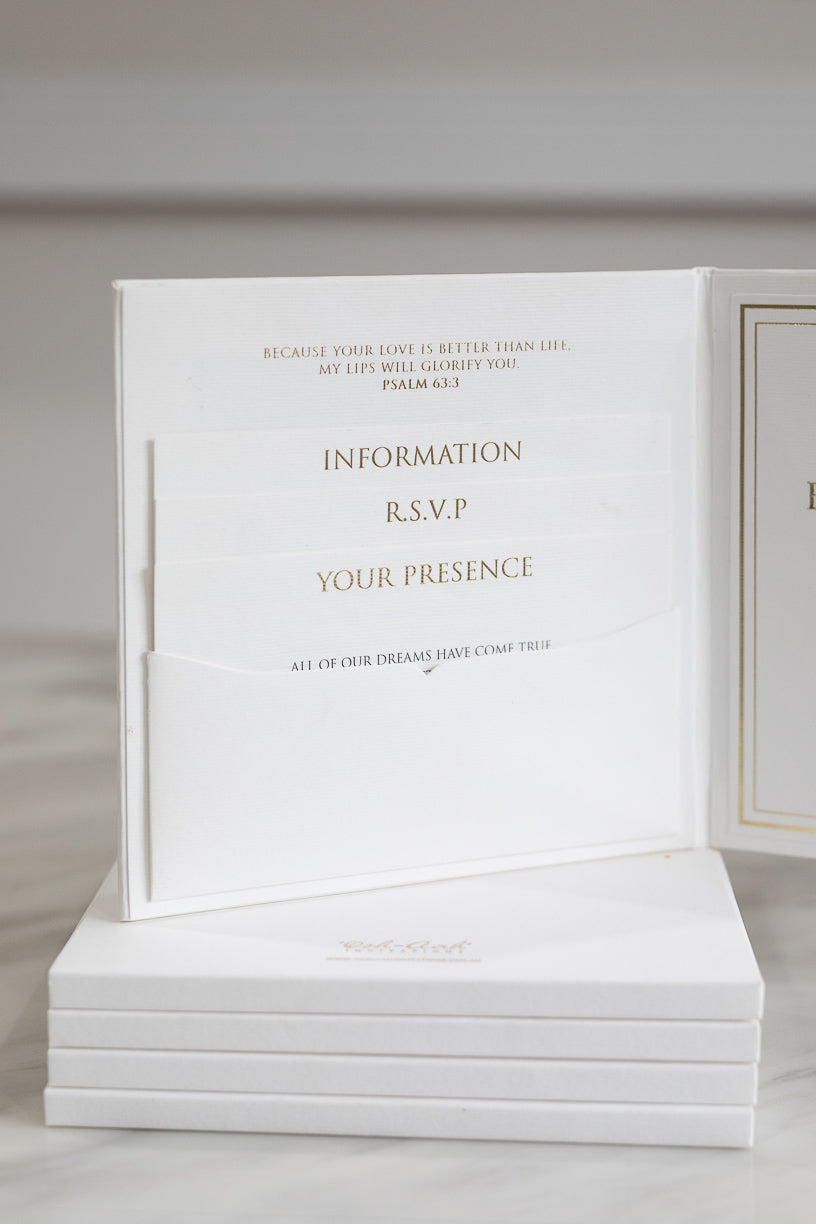 White and gold pocket fold wedding invitation with insert cards