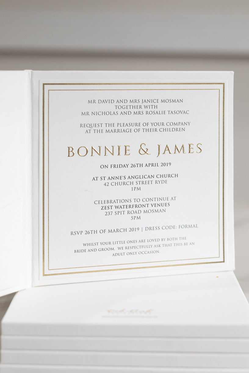 Modern white and gold wedding invitation