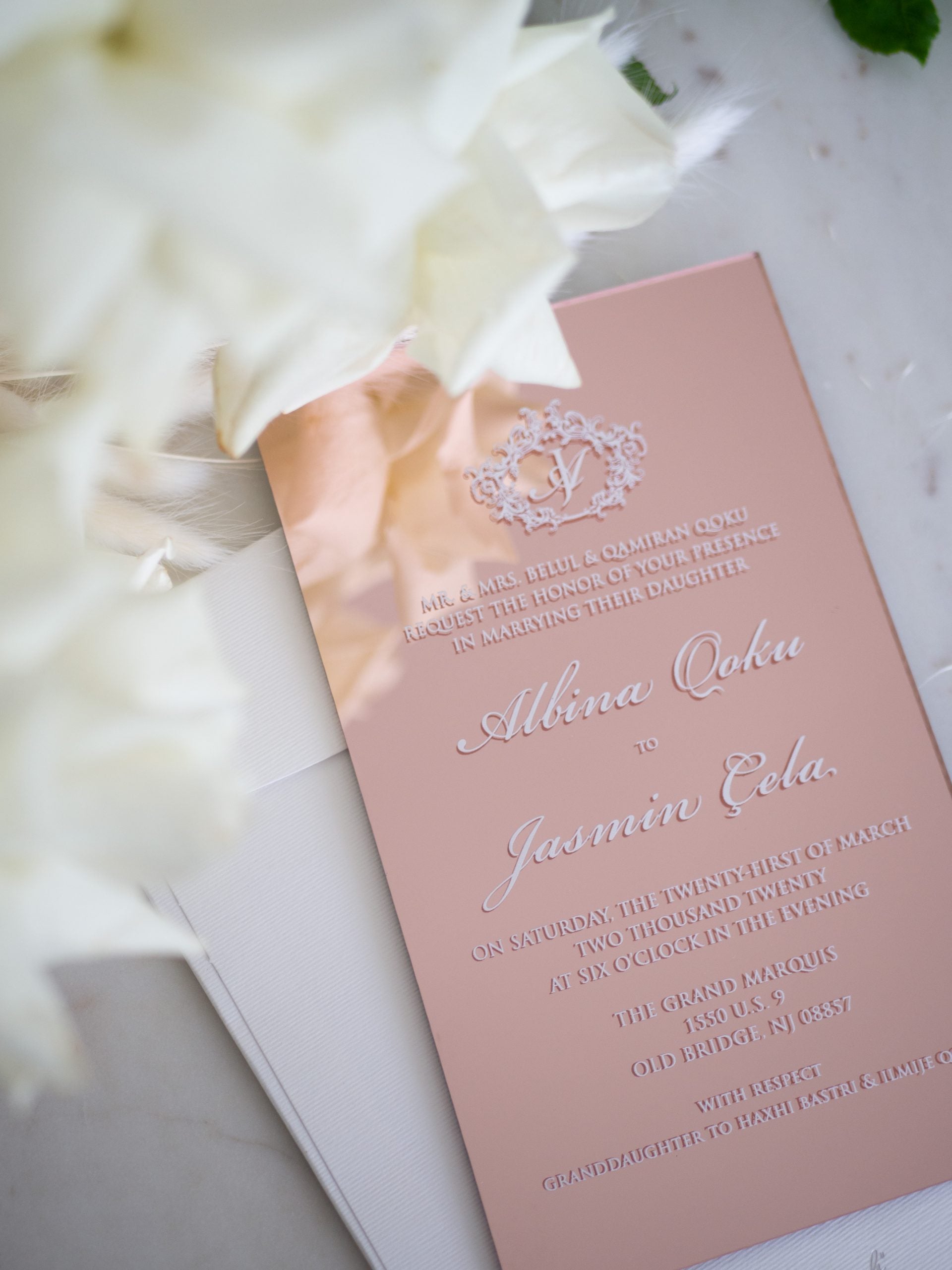 Rose gold acrylic wedding invitations with white ink print