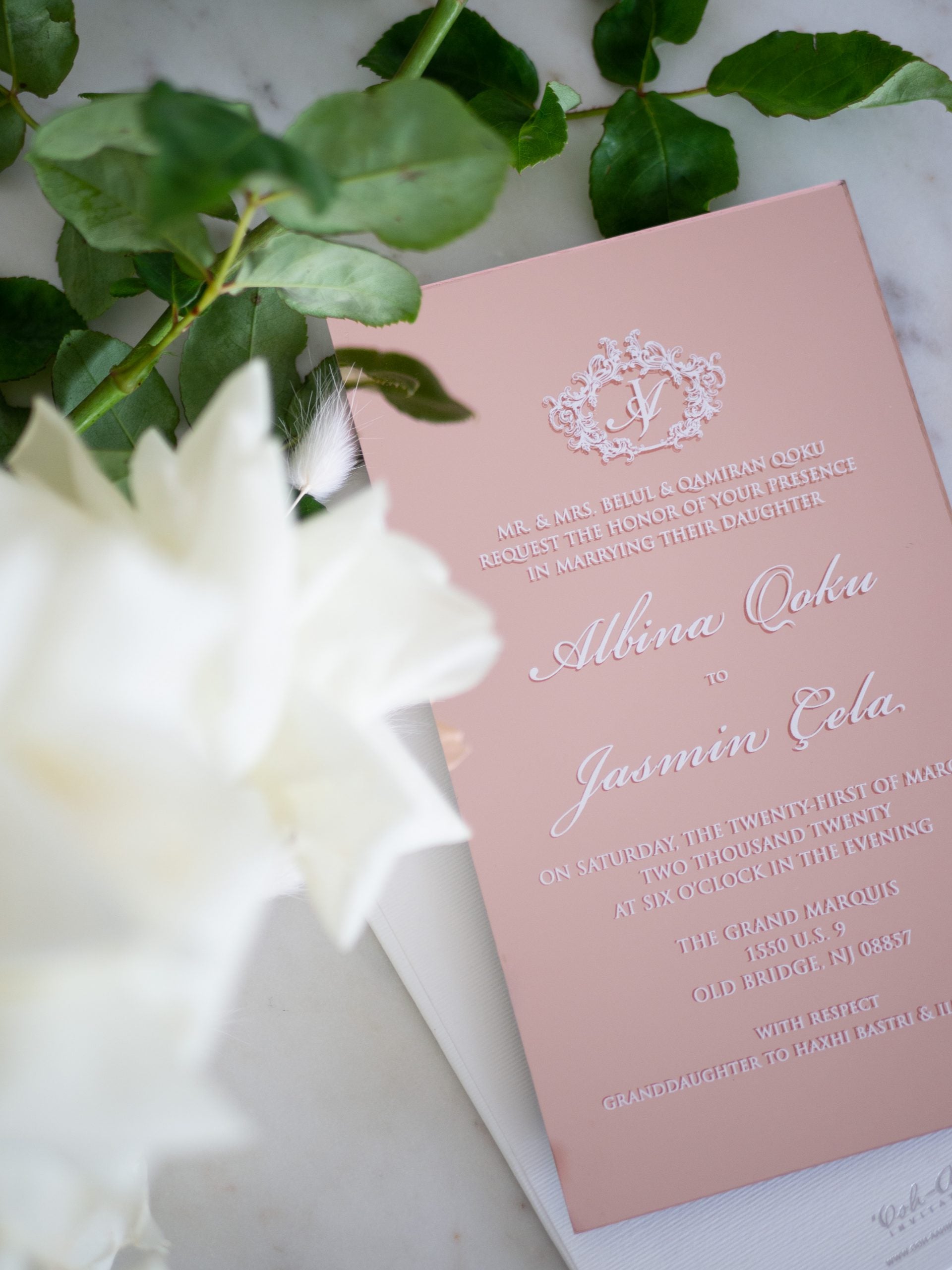 Rose gold acrylic wedding invitations with white ink print