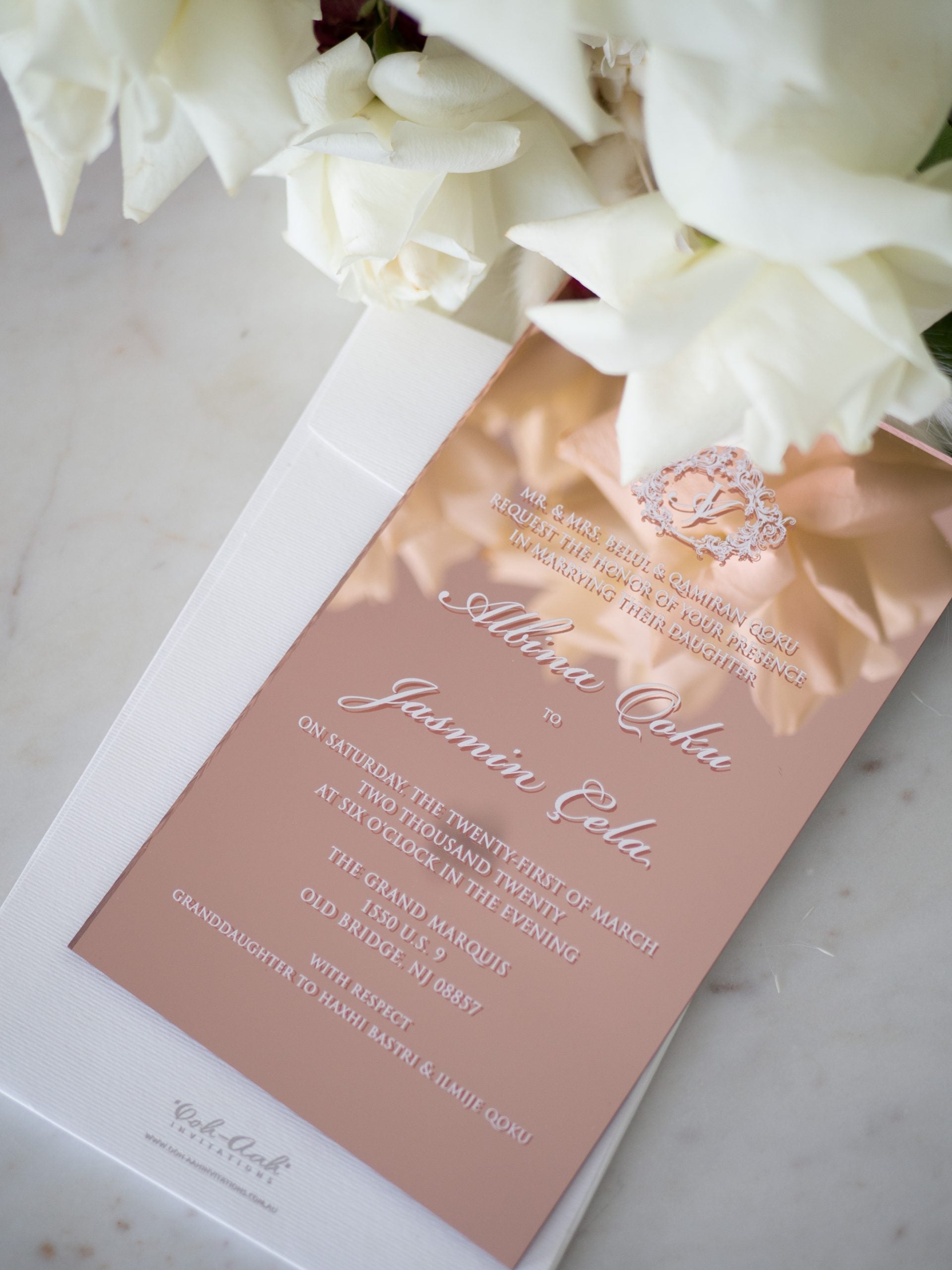 Rose gold acrylic wedding invitations with white ink print